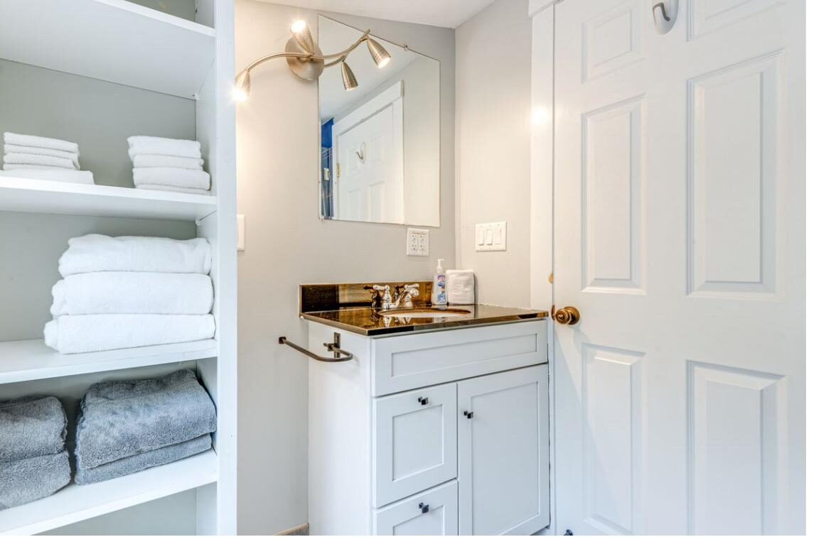 Stocked linen shelves with fresh towels