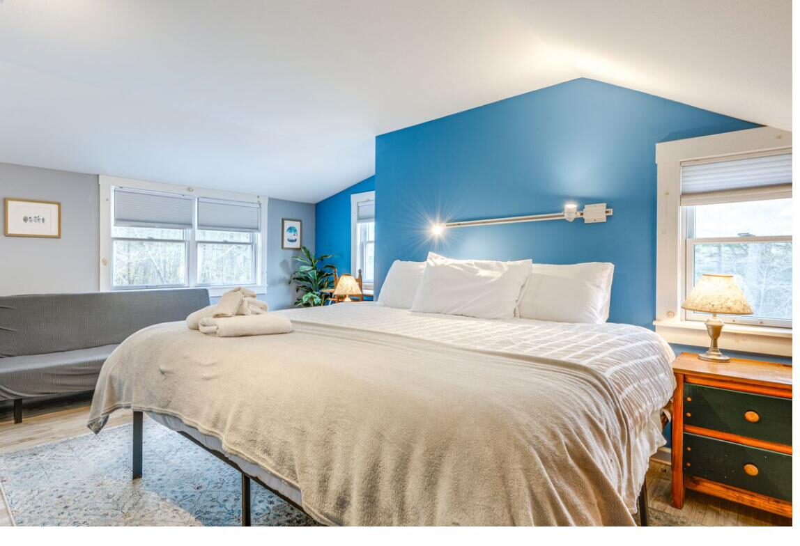 Primary bedroom with blue accent wall