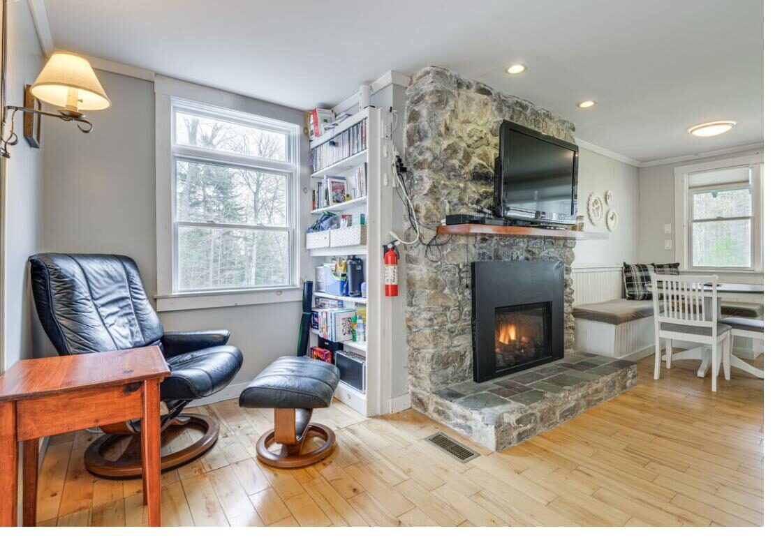 Reading chair beside the fireplace