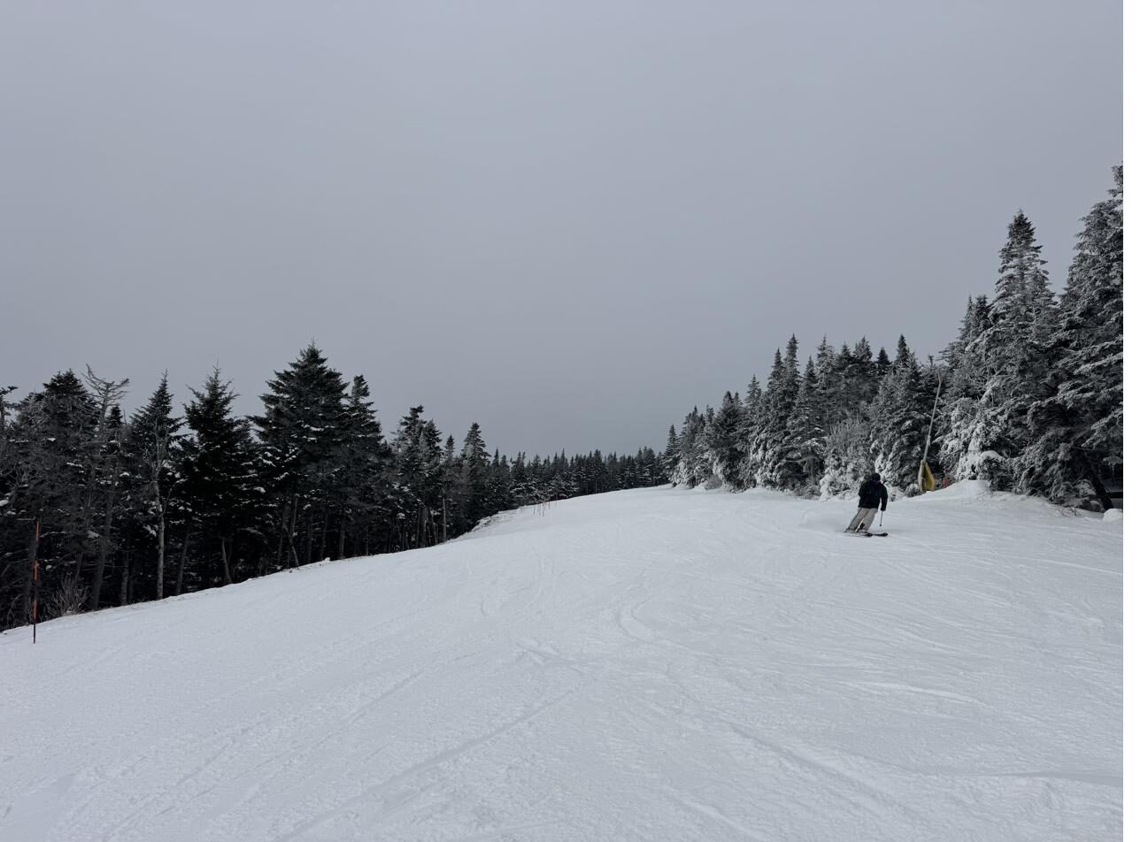 A wide, snowy ski trail in southern Vermont